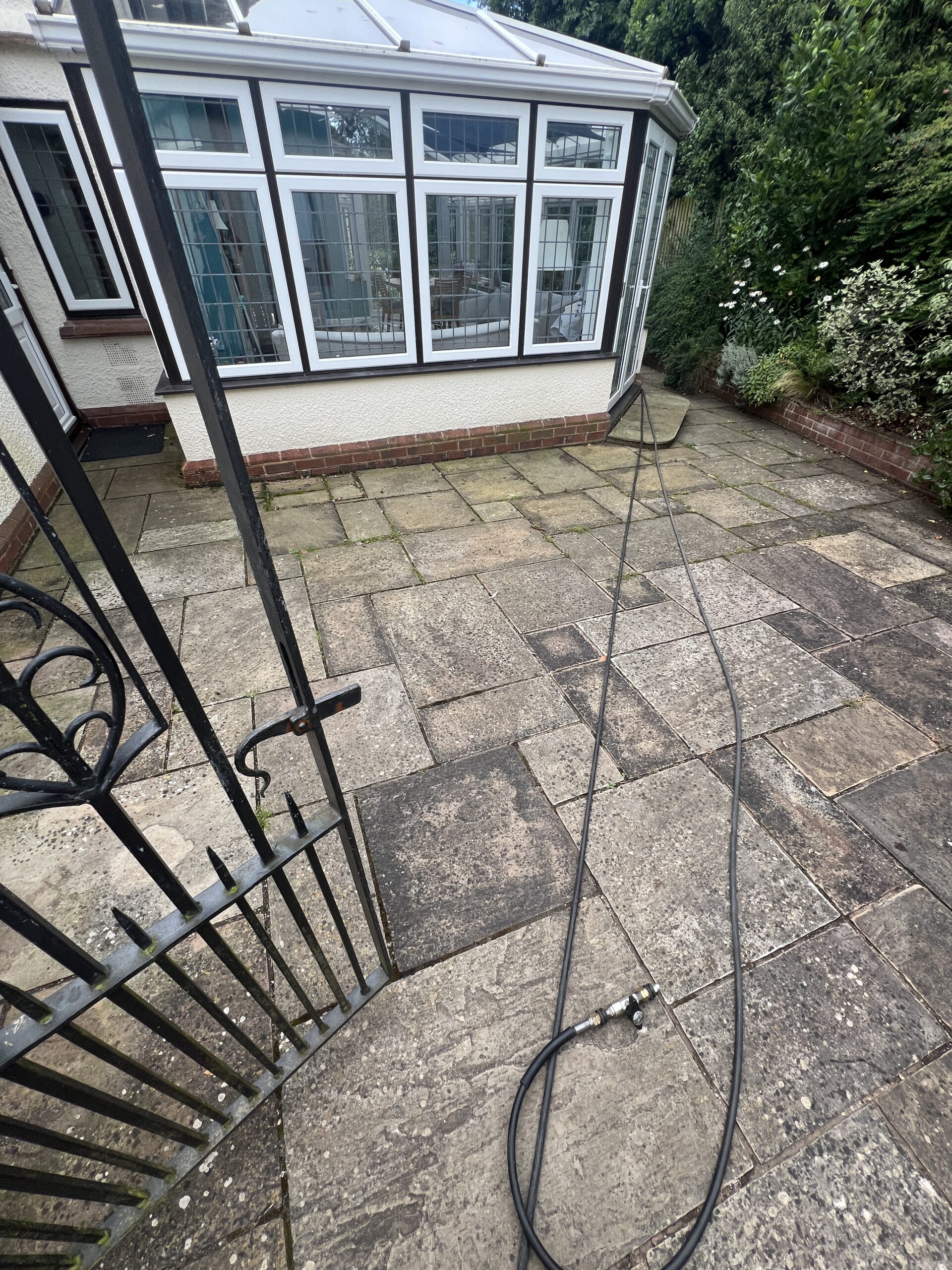 Indian Sandstone Patio Cleaning Sidmouth — Before Indian Sandstone Patio Cleaning Sidmouth — patio before cleaning