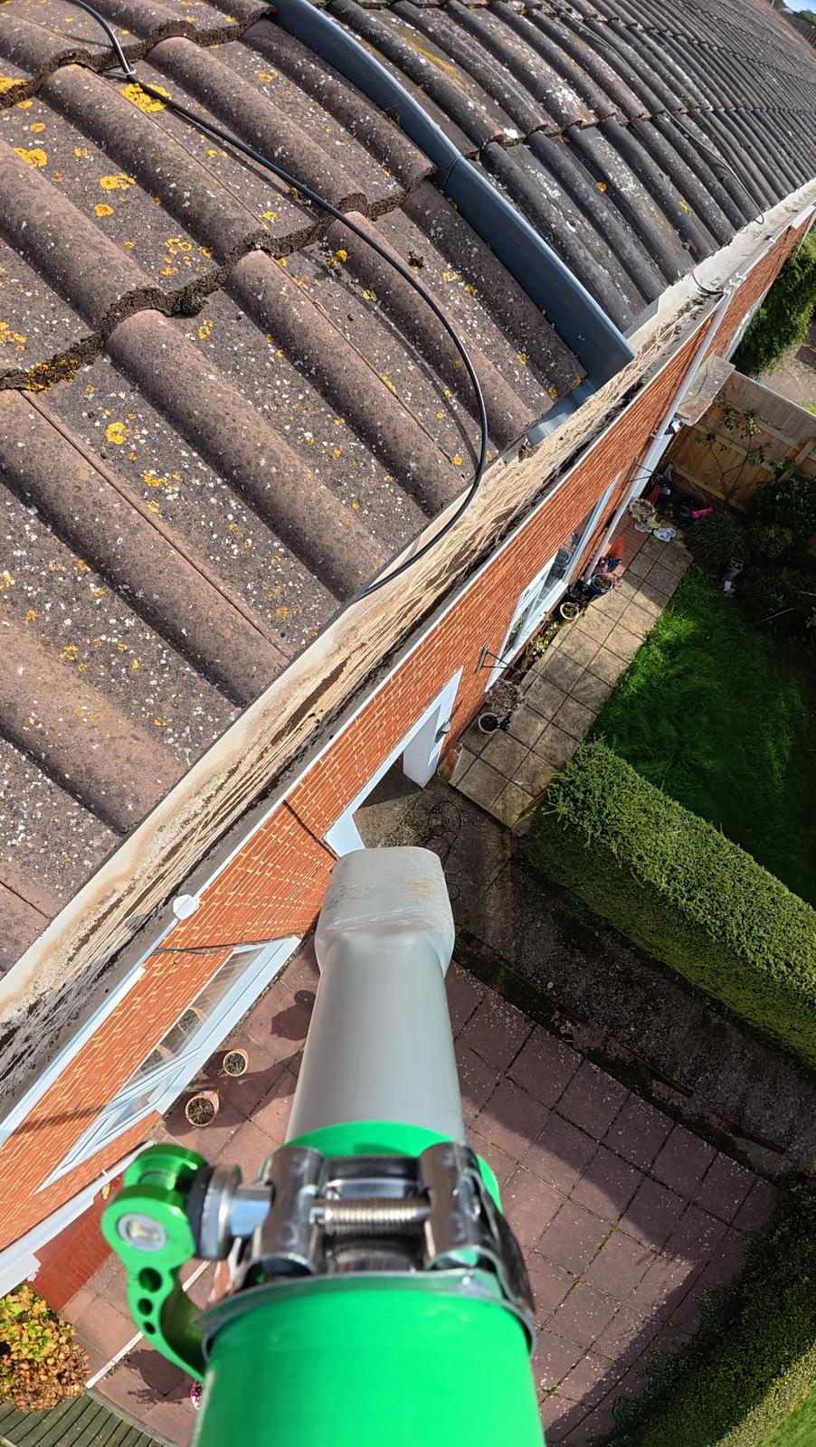 Downpipe unblocking and flow check in Great Torrington — confirming rainwater drainage